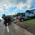 Big Mike’s Wrecker Service recovering overturned trailer on roadside in Palestine TX