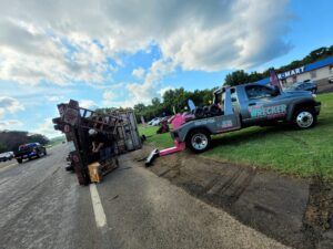 Big Mike’s Wrecker Service recovering overturned trailer on roadside in Palestine TX