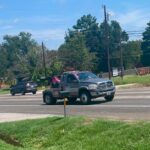 Big Mike’s Wrecker Service roadside assistance truck driving in Palestine Texas