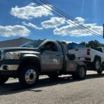 Big Mike’s Wrecker Service roadside towing service moving white pickup truck in Palestine TX