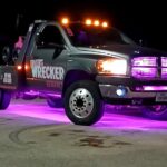 Big Mike’s Wrecker Service tow truck with emergency lights at night in Palestine TX