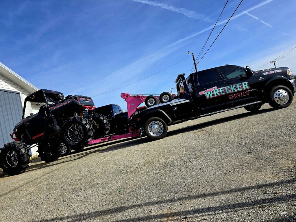 Big Mike’s Wrecker Service transporting off-road UTV on flatbed truck in Palestine TX