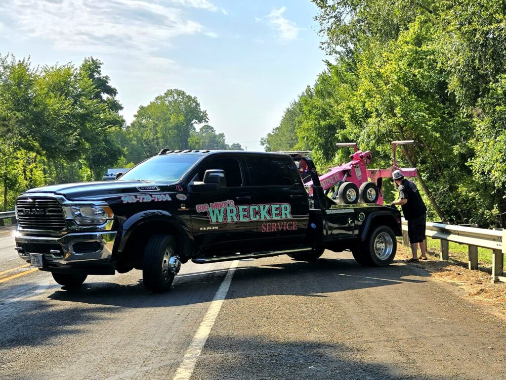 Big Mike’s Wrecker Service performing roadside towing recovery on rural road in Palestine Texas