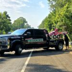 Big Mike’s Wrecker Service performing roadside towing recovery on rural road in Palestine Texas