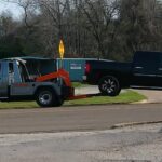 Big Mike’s Wrecker Service recovering a pickup truck with wheel lift tow truck