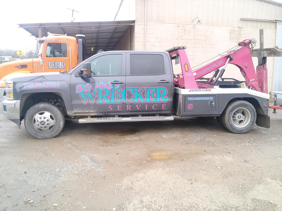 Big Mike’s Wrecker Service heavy-duty tow truck parked at shop in Palestine TX